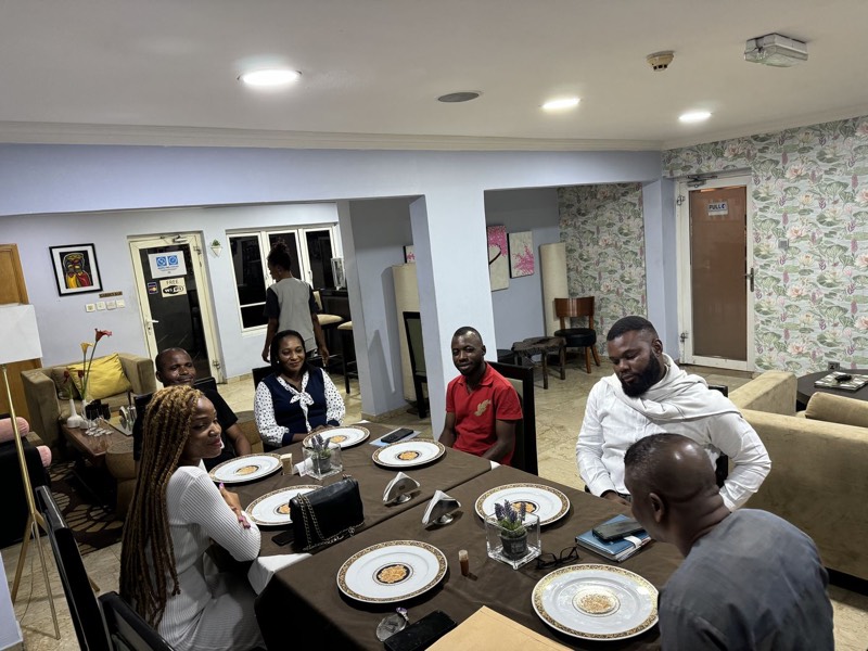 People dining around a table in a home
