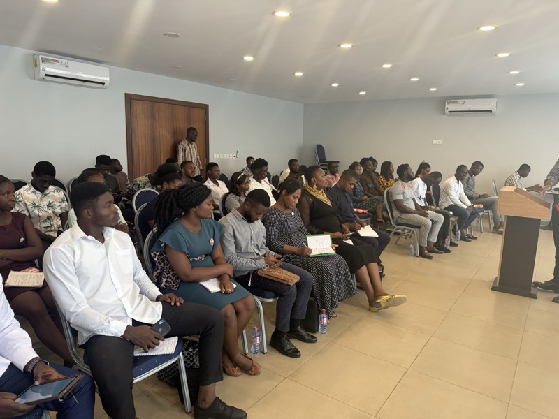 An audience seated in a hall