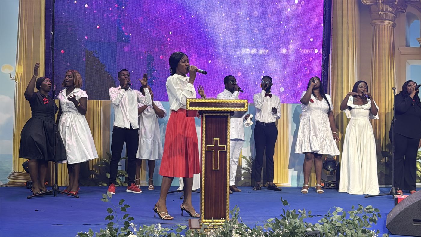 A worship team leading on stage